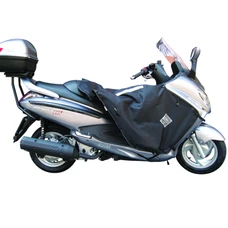 TABLIER COUVRE JAMBE TUCANO POUR SYM 125-250 JOYMAX GTS 2006> (R077-X) (TERMOSCUD) (SYSTEME ANTI-FLOTTEMENT SGAS)