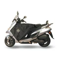 TABLIER COUVRE JAMBE TUCANO POUR KYMCO 50-125-200 DINK 2006> (R065-X) (TERMOSCUD) (SYSTEME ANTI-FLOTTEMENT SGAS)
